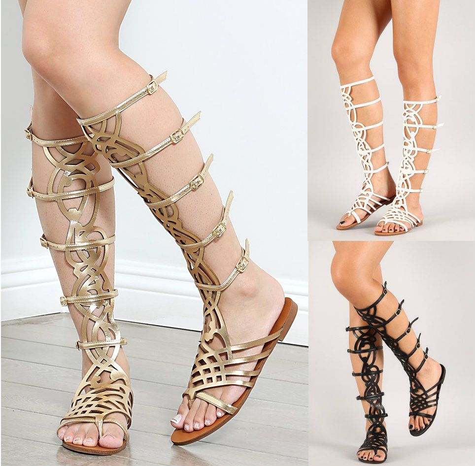 Featuring an open toe front, caged construction, adjustable buckle ...